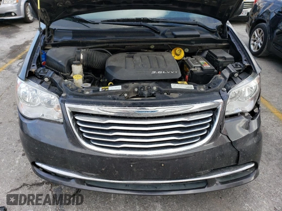 2015 Chrysler Town & Country LX with VIN 2C4RC1AG6FR675771, listed as a Copart auction lot 82665674 with 146,636 mi miles and Salvage Title. Bid and sale history available at carsss.com. Image 12.