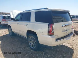 2015 GMC Yukon Denali with VIN 1GKS2CKJ3FR568729, listed as a IAAI auction lot 41741987 with 154,729 mi miles. Bid and sale history available at carsss.com. Image 3.