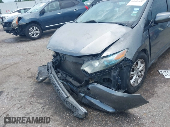 2010 Honda Insight EX z VIN JHMZE2H72AS023404, wystawiony jako IAAI lot #42505042 z przebiegiem Nie podano mil oraz . Historia ofert i sprzedaży dostępna na DreamBid. Obrazek 6.