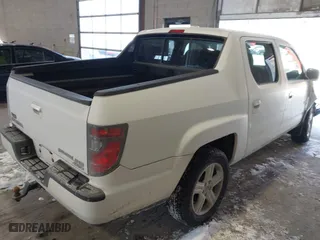 2014 Honda Ridgeline RTL with VIN 5FPYK1F55EB012490, listed as a IAAI auction lot 41391884 with 130,121 mi miles. Bid and sale history available at carsss.com. Image 4.