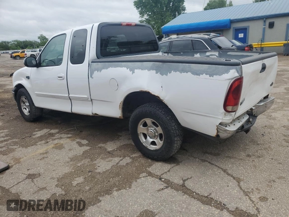 2002 Ford F-150 XL with VIN 1FTRX17L52KC49698, listed as a Copart auction lot 54307145 with 254,394 mi miles and Salvage title. Bid and sale history available at DreamBid. Image 2.