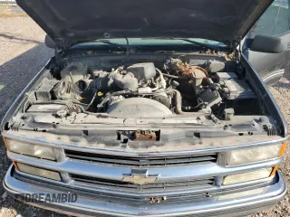 1999 Chevrolet Suburban with VIN 1GNFK16R4XJ483035, listed as a Copart auction lot 76666034 with 215,048 mi miles and Clean Title. Bid and sale history available at carsss.com. Image 12.