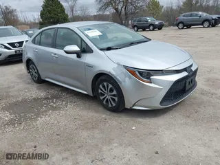 2020 Toyota Corolla Hybrid LE with VIN JTDEBRBE1LJ008409, listed as a IAAI auction lot 41948940 with 102,402 mi miles. Bid and sale history available at carsss.com. Image 1.