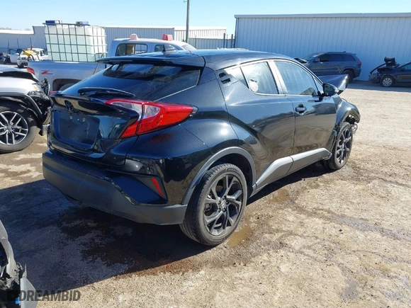 2021 Toyota C-HR LE with VIN JTNKHMBX2M1098138, listed as a IAAI auction lot 41679903 with 49,390 mi miles. Bid and sale history available at carsss.com. Image 4.