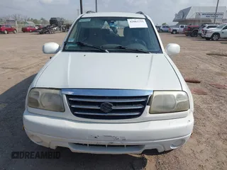 2003 Suzuki XL7 Touring z VIN JS3TY92V534106381, wystawiony jako IAAI lot #42063755 z przebiegiem 190 917 mil mil oraz . Historia ofert i sprzedaży dostępna na DreamBid. Obrazek 12.