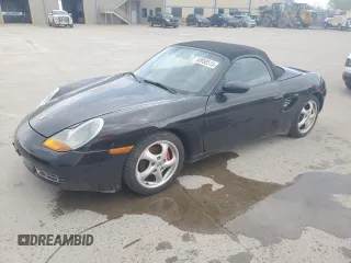 1998 Porsche Boxster z VIN WP0CA2982WU620882, wystawiony jako Copart lot #50950515 z przebiegiem Nie podano mil oraz Szkoda całkowita • Salvage title. Historia ofert i sprzedaży dostępna na DreamBid. Obrazek 1.