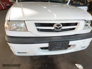 2002 Mazda B-Series 2WD Truck DS with VIN 4F4YR16V42TM25828, listed as a IAAI auction lot 41440414 with 132,334 mi miles. Bid and sale history available at carsss.com. Image 14.