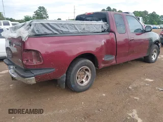 1998 Ford F-150 z VIN 1FTDX0766WKA08902, wystawiony jako IAAI lot #42095276 z przebiegiem 202 468 mil mil oraz . Historia ofert i sprzedaży dostępna na DreamBid. Obrazek 4.