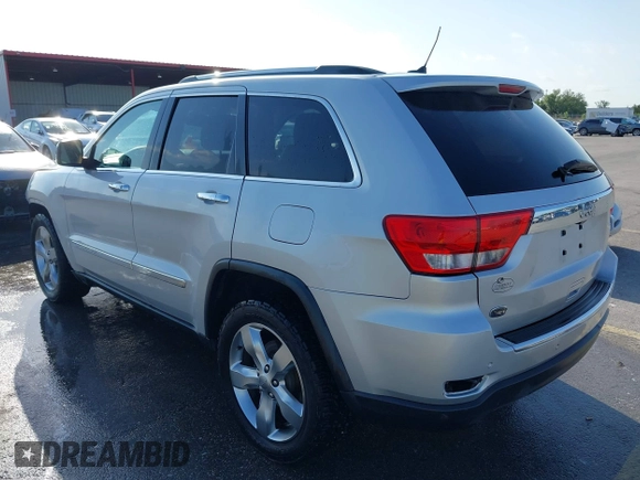 2013 Jeep Grand Cherokee Overland with VIN 1C4RJECG9DC545886, listed as a IAAI auction lot 41998913 with 166,077 mi miles. Bid and sale history available at carsss.com. Image 3.