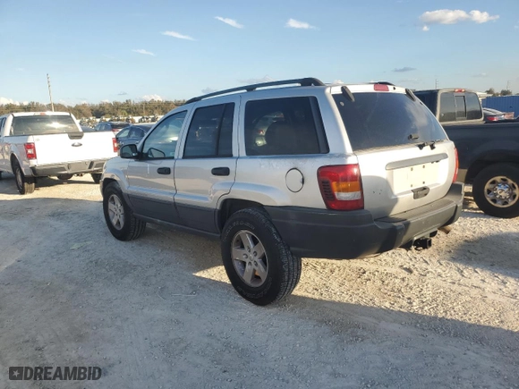 2004 Jeep Grand Cherokee Laredo with VIN 1J4GX48N74C406647, listed as a Copart auction lot 77631654 with 174,824 mi miles and Salvage Title. Bid and sale history available at carsss.com. Image 2.
