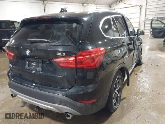 2018 BMW X1 xDrive28i with VIN WBXHT3C30J5K29383, listed as a IAAI auction lot 41503314 with 107,678 mi miles. Bid and sale history available at carsss.com. Image 4.
