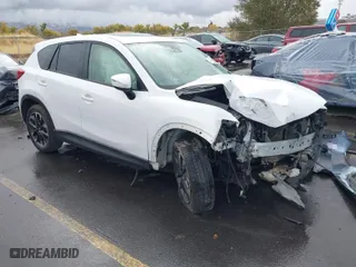 2016 Mazda CX-5 Grand Touring with VIN JM3KE4DY0G0705691, listed as a IAAI auction lot 40880798 with 130,624 mi miles. Bid and sale history available at carsss.com. Image 1.