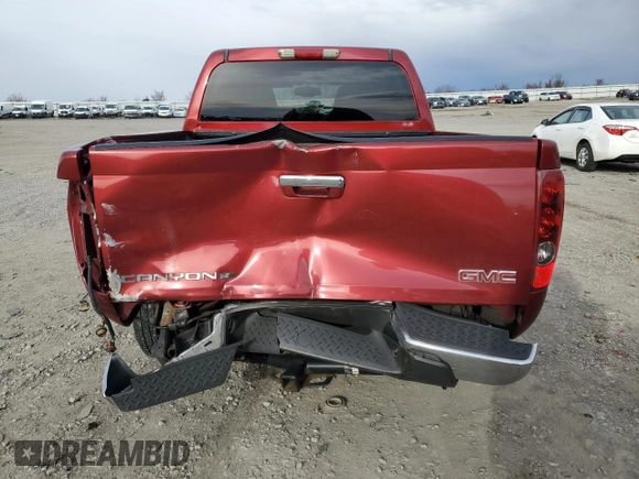 2011 GMC Canyon SLE1 with VIN 1GTH6MFE5B8134177, listed as a Copart auction lot 48243605 with 133,956 mi miles and Salvage Title. Bid and sale history available at carsss.com. Image 6.