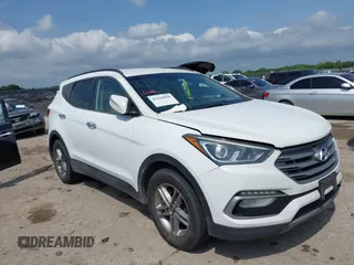 2018 Hyundai Santa Fe 2.4L z VIN 5NMZUDLB3JH055771, wystawiony jako IAAI lot #42126058 z przebiegiem 142 991 mil mil oraz . Historia ofert i sprzedaży dostępna na DreamBid. Obrazek 1.