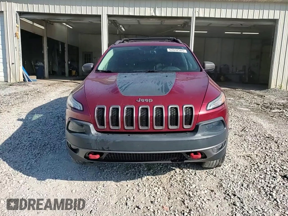 2015 Jeep Cherokee Trailhawk with VIN 1C4PJMBS1FW745928, listed as a Copart auction lot 62032585 with 132,559 mi miles and Salvage title. Bid and sale history available at DreamBid. Image 14.