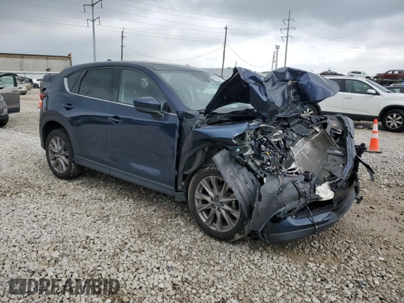2019 Mazda CX-5 Grand Touring with VIN JM3KFBDM4K0676946, listed as a Copart auction lot 61040465 with Not provided miles and Salvage title. Bid and sale history available at DreamBid. Image 4.