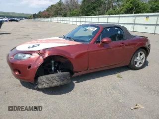 2006 Mazda MX-5 Miata Grand Touring with VIN JM1NC25F960103772, listed as a Copart auction lot 65610385 with 130,736 mi miles and Salvage title. Bid and sale history available at DreamBid. Image 1.