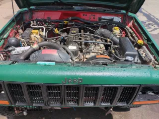 1998 Jeep Cherokee Sport with VIN 1J4FJ68SXWL210381, listed as a Copart auction lot 58398995 with 211,870 mi miles and Salvage title. Bid and sale history available at DreamBid. Image 12.