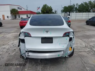 2023 Tesla Model Y Long Range z VIN 7SAYGDEE0PA065534, wystawiony jako IAAI lot #42445868 z przebiegiem 22 638 mil mil oraz . Historia ofert i sprzedaży dostępna na DreamBid. Obrazek 16.