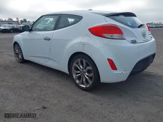 2014 Hyundai Veloster with VIN KMHTC6ADXEU213073, listed as a IAAI auction lot 41551346 with 130,549 mi miles. Bid and sale history available at carsss.com. Image 3.