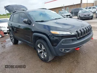 2015 Jeep Cherokee Trailhawk with VIN 1C4PJMBS5FW647601, listed as a IAAI auction lot 42437734 with 170,640 mi miles and . Bid and sale history available at DreamBid. Image 1.