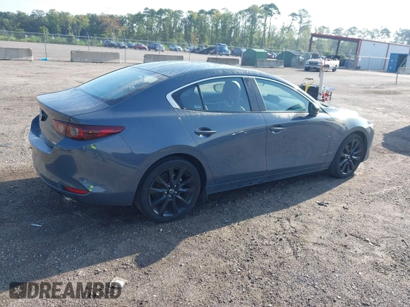 2024 Mazda 3 S Carbon Edition with VIN 3MZBPBCM6RM411828, listed as a IAAI auction lot 42802141 with 40,061 mi miles and . Bid and sale history available at DreamBid. Image 4.