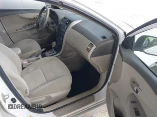 2010 Toyota Corolla with VIN 1NXBU4EE0AZ335239, listed as a IAAI auction lot 42155710 with 215,134 mi miles. Bid and sale history available at carsss.com. Image 5.