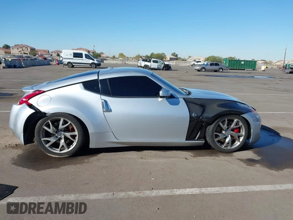 2014 Nissan 370Z Nismo with VIN JN1AZ4EHXEM634418, listed as a IAAI auction lot 41308580 with 84,074 mi miles and . Bid and sale history available at DreamBid. Image 13.