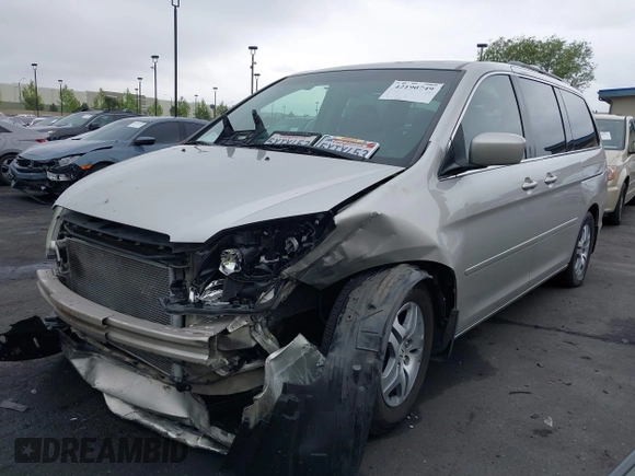 2007 Honda Odyssey EX-L with VIN 5FNRL38687B423865, listed as a IAAI auction lot 42190749 with 215,664 mi miles and . Bid and sale history available at DreamBid. Image 2.