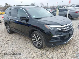 2017 Honda Pilot Touring with VIN 5FNYF6H90HB051700, listed as a IAAI auction lot 41902075 with 69,712 mi miles. Bid and sale history available at carsss.com. Image 1.