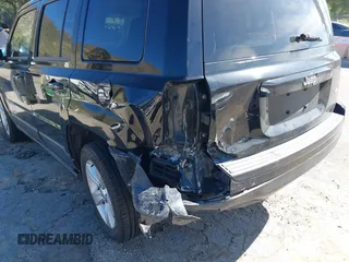 2013 Jeep Patriot Latitude with VIN 1C4NJPFA5DD230031, listed as a IAAI auction lot 41641768 with 153,910 mi miles. Bid and sale history available at carsss.com. Image 6.