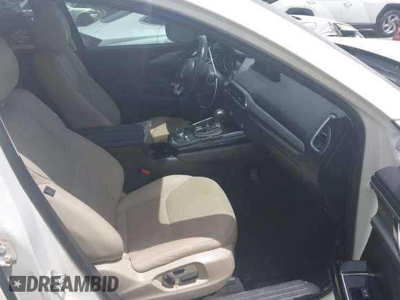 2021 Mazda CX-9 Touring with VIN JM3TCACY9M0526376, listed as a IAAI auction lot 42264478 with 74,671 mi miles and . Bid and sale history available at DreamBid. Image 5.