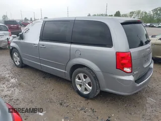 2013 Dodge Grand Caravan SE with VIN 2C4RDGBG2DR773577, listed as a IAAI auction lot 41823951 with 226,498 mi miles and . Bid and sale history available at DreamBid. Image 3.