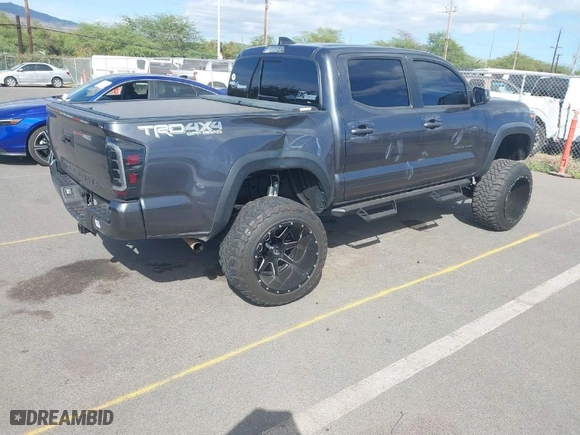 2021 Toyota Tacoma 4WD SR with VIN 3TMCZ5ANXMM447464, listed as a IAAI auction lot 41409203 with 39,390 mi miles. Bid and sale history available at carsss.com. Image 4.