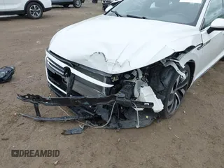 2021 Volkswagen Arteon SEL R-Line z VIN WVWSR7AN6ME007156, wystawiony jako IAAI lot #42254735 z przebiegiem 32 004 mil mil oraz . Historia ofert i sprzedaży dostępna na DreamBid. Obrazek 6.