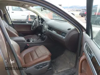 2013 Volkswagen Touareg Lux with VIN WVGEF9BP1DD012851, listed as a IAAI auction lot 41732391 with 123,283 mi miles and . Bid and sale history available at DreamBid. Image 5.