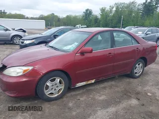 2003 Toyota Camry LE z VIN 4T1BF32K63U050174, wystawiony jako IAAI lot #42260843 z przebiegiem 210 486 mil mil oraz . Historia ofert i sprzedaży dostępna na DreamBid. Obrazek 13.