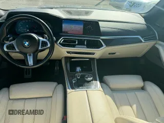 2021 BMW X5 M50i with VIN 5UXJU4C00M9H36466, listed as a Copart auction lot 77444344 with 100,119 mi miles and Clean Title. Bid and sale history available at carsss.com. Image 6.