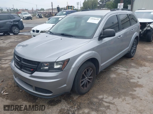 2018 Dodge Journey SE with VIN 3C4PDCAB1JT141295, listed as a IAAI auction lot 42098218 with 110,691 mi miles. Bid and sale history available at carsss.com. Image 2.