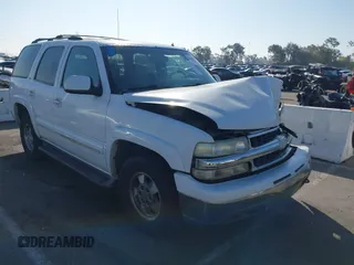 2002 Chevrolet Tahoe LS z VIN 1GNEC13TX2R240719, wystawiony jako IAAI lot #41616356 z przebiegiem 235 081 mil mil oraz . Historia ofert i sprzedaży dostępna na DreamBid. Obrazek 1.