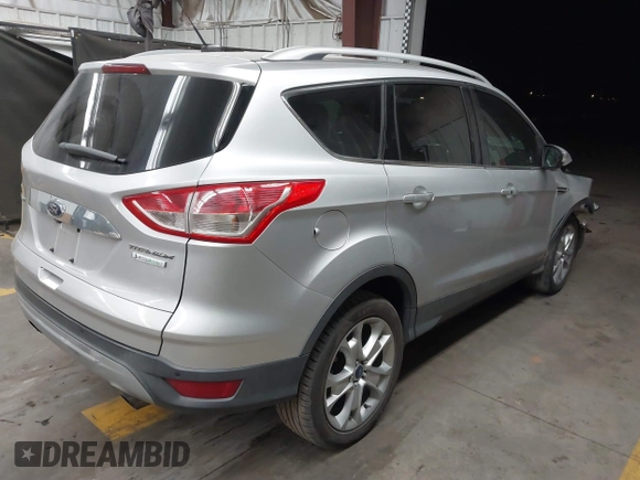 2015 Ford Escape Titanium with VIN 1FMCU0J96FUB81598, listed as a IAAI auction lot 41872114 with 122,001 mi miles and . Bid and sale history available at DreamBid. Image 4.