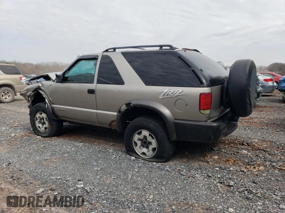 2004 Chevrolet Blazer LS z VIN 1GNCT18X34K143280, wystawiony jako Copart lot #50494785 z przebiegiem Nie podano mil oraz Szkoda całkowita • Salvage title. Historia ofert i sprzedaży dostępna na DreamBid. Obrazek 2.