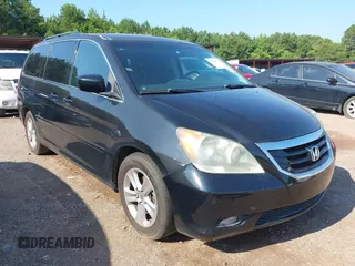 2010 Honda Odyssey Touring with VIN 5FNRL3H97AB104359, listed as a IAAI auction lot 42555872 with 233,952 mi miles and . Bid and sale history available at DreamBid. Image 1.