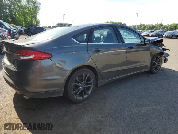 2018 Ford Fusion SE z VIN 3FA6P0LU9JR242443, wystawiony jako Copart lot #58049355 z przebiegiem 123 990 mil mil oraz Szkoda całkowita • Salvage title. Historia ofert i sprzedaży dostępna na DreamBid. Obrazek 3.