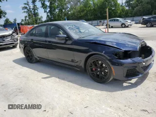 2023 BMW 5 Series 530i with VIN WBA53BH04PWY02486, listed as a Copart auction lot 54519385 with 26,979 mi miles and Salvage title. Bid and sale history available at DreamBid. Image 4.