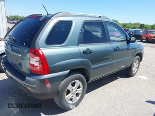 2009 Kia Sportage LX with VIN KNDJF724497602223, listed as a IAAI auction lot 42085415 with 91,105 mi miles. Bid and sale history available at carsss.com. Image 4.