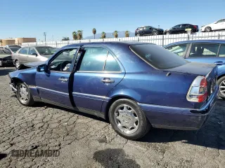 1996 Mercedes-Benz C with VIN WDBHA28E5TF406948, listed as a Copart auction lot 80234944 with 239,256 mi miles and Salvage Title. Bid and sale history available at carsss.com. Image 2.