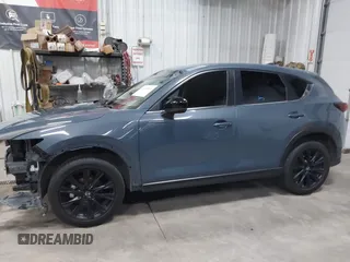 2021 Mazda CX-5 Touring z VIN JM3KFBCM4M0459465, wystawiony jako IAAI lot #41059836 z przebiegiem 74 645 mil mil oraz . Historia ofert i sprzedaży dostępna na DreamBid. Obrazek 15.