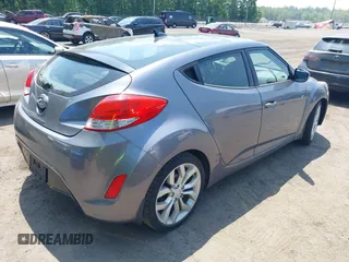 2013 Hyundai Veloster w/Gray Int with VIN KMHTC6AD5DU132237, listed as a IAAI auction lot 42268005 with 84,646 mi miles and . Bid and sale history available at DreamBid. Image 4.