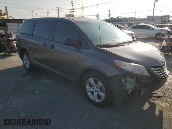 2012 Toyota Sienna with VIN 5TDKA3DC6CS010187, listed as a Copart auction lot 86885234 with 145,745 mi miles and Salvage Title. Bid and sale history available at DreamBid. Image 4.